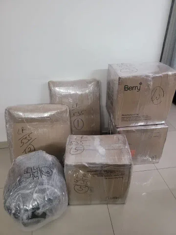 A small group of individually wrapped cartons and a separate wrapped bundle.