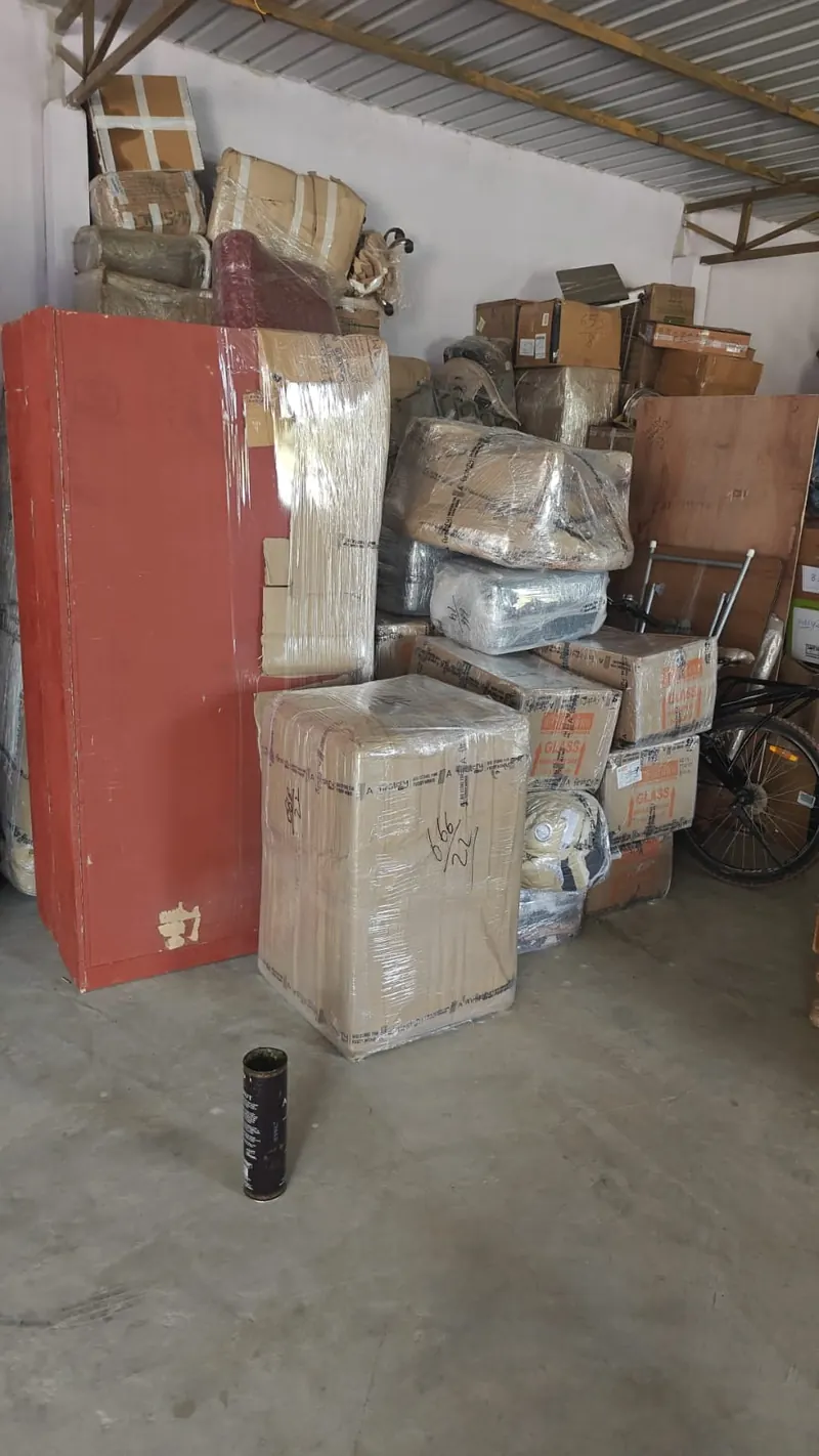 Wrapped steel almirah and packed household cartons