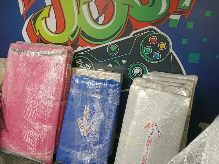 Several flat rectangular pieces wrapped individually and standing together.
