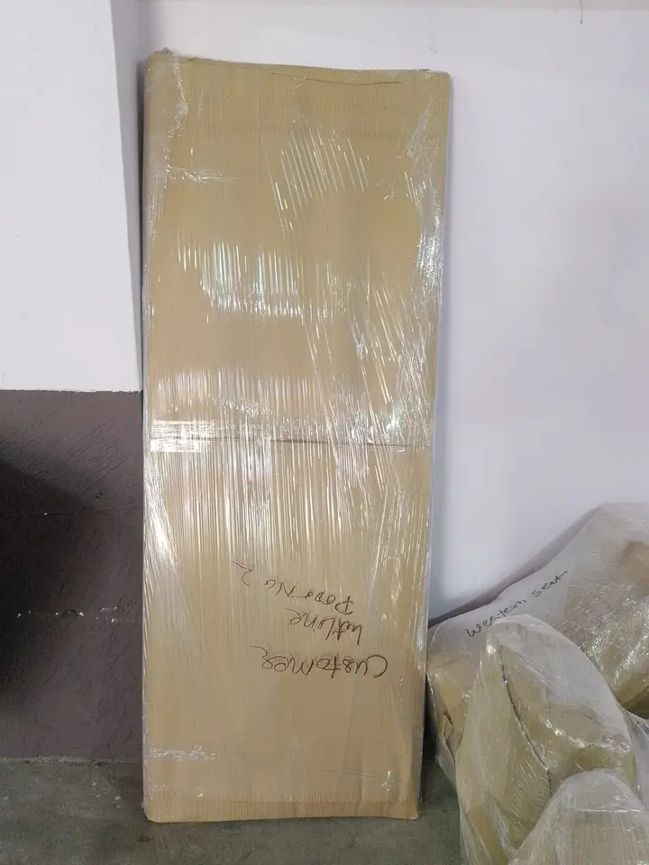 A tall rectangular piece covered in protective wrapping.